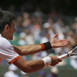 
              Serbia's Novak Djokovic gestures after missing a return in the third round match of the French Open tennis tournament against Thanissi Kokkakis of Australia at the Roland Garros stadium, in Paris, France, Saturday, May 30, 2015. (AP Photo/David Vincent)
            