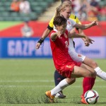 
              FILE - In this June 11, 2015, file photo, China's Han Peng (18) and Netherlands Stefanie van der Gragt battle for the ball during the second half of a FIFA Women's World Cup soccer game in Edmonton, Alberta, Canada. The fields are heating up, there are little black rubber pellets everywhere, and feet are covered with blisters.  The use of artificial turf at this year’s tournament in Canada has been a contentious issue with the players since it was included in the nation’s bid in 2011. (Jason Franson/The Canadian Press via AP, File) MANDATORY CREDIT
            