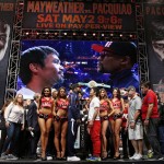 
              Floyd Mayweather Jr., center left, and Manny Pacquiao pose during their weigh-in on Friday, May 1, 2015 in Las Vegas. The world weltherweight title fight between Mayweather Jr. and Pacquiao is scheduled for May 2. (AP Photo/John Locher)
            