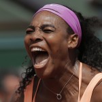 
              Serena Williams of the U.S. celebrates winning the quarterfinal match of the French Open tennis tournament against Italy's Sara Errani in two sets 6-1, 6-3, at the Roland Garros stadium, in Paris, France, Wednesday, June 3, 2015. (AP Photo/Christophe Ena)
            