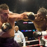 
              FILE - In this June 20, 2015, file photo, David Lemieux, left, from Montreal, trades punches with Hassan N'Dam, from France, during the 12th round of their boxing match for the vacant IBF middleweight title in Montreal. Lemieux won the bout with a unanimous decision. Lemieux will meet Gennady Golovkin in a three-belt middleweight title unification bout next Oct. 17, 2015, in New York. Lemieux (34-2, 31 KOs) is the IBF middleweight champion, while Golovkin (33-0, 30 KOs) holds the WBA belt and the WBC interim belt. (Ryan Remiorz/The Canadian Press via AP, File)
            
