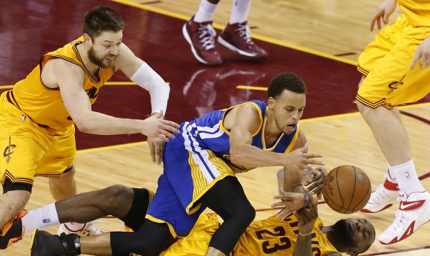 Golden State Warriors guard Stephen Curry and Cleveland Cavaliers forward LeBron James (23) and gua...