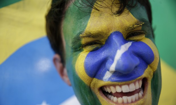 n FILE – In this July 4, 2014, file photo, a soccer fan with his face painted to represent Br...