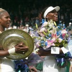 
              FILE - In this July 6, 2002 file photo, Serena Williams, left, holds her trophy after defeating her sister Venus, right, to win the Women's Singles final on the Centre Court  at the All England Lawn Tennis Championships in Wimbledon, London. Following wins at the Australian and French Opens, Serena can become the fourth woman to win the calendar Grand Slam this year. Serena goes to this year’s Wimbledon as the overwhelming favorite to win her sixth Wimbledon title and claim her 21st Grand Slam singles title, which would put her one behind Steffi Graf and three behind Margaret Court’s record of 24. Serena’s sister, Venus, has won five Wimbledon titles. (AP Photo/Ted S.Warren, File)
            