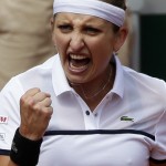
              Timea Bacsinszky of Switzerland reacts as she plays Belgium's Alison van Uytvanck during their quarterfinal match of the French Open tennis tournament, at the Roland Garros stadium, Wednesday, June 3, 2015 in Paris. (AP Photo/Thibault Camus)
            