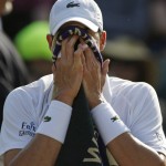 
              John Isner of the United States wipes his face during a change of ends break as he plays Marin Cilic of Croatia during their singles match at the All England Lawn Tennis Championships in Wimbledon, London, Friday July 3, 2015. (AP Photo/Pavel Golovkin)
            