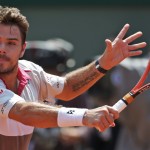 
              Switzerland's Stan Wawrinka returns in the semifinal match of the French Open tennis tournament against France's Jo-Wilfried Tsonga at the Roland Garros stadium, in Paris, France, Friday, June 5, 2015. (AP Photo/Michel Euler)
            