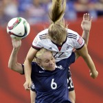 
              Germany's Tabea Kemme (22) and France's Amandine Henry (6) battle for a head ball during the first half of a FIFA Women's World Cup quarterfinal soccer game, Friday, June 26, 2015, in Montreal, Quebec, Canada. (Ryan Remiorz/The Canadian Press via AP) MANDATORY CREDIT
            