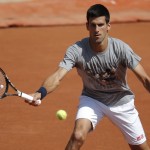 
              Serbia's Novak Djokovic returns the ball during a training session for the French Tennis Open at the Roland Garros stadium, Friday, May 22, 2015 in Paris. The French Open starts Sunday. (AP Photo/Francois Mori)
            