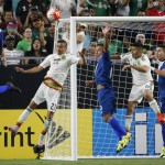 
              Guatemala's Minor Lopez, left, deflects the ball in front of Mexico's Paul Aguilar, second from left, and Guatemala's Jose Contreras, middle, as Mexico's Oribe Peralta (19) moves in front of Guatemala's Elias Enoc Vasquez (3) during the first half of a CONCACAF Gold Cup soccer match Sunday, July 12, 2015, in Glendale, Ariz. (AP Photo/Ross D. Franklin)
            