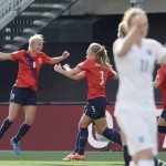
              Norway's Solveig Gulbrandsen, left, celebrates with teammates after scoring against England during the second half of a second round soccer game at the FIFA Women's World Cup, Monday, June 22, 2015, in Ottawa, Ontario, Canada. (Adrian Wyld/The Canadian Press via AP) MANDATORY CREDIT
            