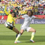 
              Colombia's Angela Clavijo (13) stretches for the ball in front of United States' Lauren Holiday  during first half FIFA Women's World Cup round of 16 soccer action in Edmonton, Alberta, Canada, Monday, June 22, 2015.  (Jason Franson/The Canadian Press via AP) MANDATORY CREDIT
            