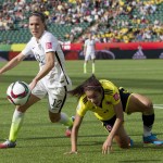 
              FILE - In this Monday, June 22, 2015, file photo, United States' Lauren Holiday (12) and Colombia's Orianica Velasquez (9) battle for the ball during the first half of a second round game at the FIFA Women's World Cup in Edmonton, Alberta, Canada. The United States has made it to the quarterfinals but will have to face China on Friday without two key players. Midfielders Lauren Holiday and Megan Rapinoe are out because of accumulated yellow cards.  (Jason Franson/The Canadian Press via AP, File) MANDATORY CREDIT
            