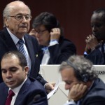 
              FIFA president Joseph S. Blatter, left, walks past Prince Ali bin al-Hussein, left, and UEFA President Michel Platini, center, during the 65th FIFA Congress held at the Hallenstadion in Zurich, Switzerland, Friday, May 29, 2015, where he will run for re-election as FIFA head. (Walter Bieri/Keystone via AP)
            