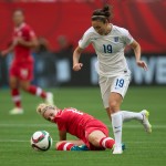
              Canada's Lauren Sesselmann, left, misplays the ball as England's Jodie Taylor (19) gets ready to move toward the Canadian goal during the first half of a quarterfinal of the Women's World Cup soccer tournament, Saturday, June 27, 2015, in Vancouver, British Columbia, Canada. Taylor scored shortly afterward. (Darryl Dyck/The Canadian Press via AP
            