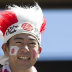 
              A Japan fan watches warm ups before Japan takes on Australia during first half FIFA Women's World Cup quarter-final action in Edmonton, Alberta, Canada, on Saturday June 27, 2015.  (Jason Franson  /The Canadian Press via AP) MANDATORY CREDIT
            