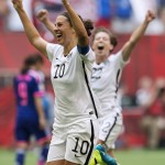 
              United States' Carli Lloyd (10) and Meghan Klingenberg (22) celebrate Lloyd's third goal against Japan during first half action in the FIFA Women's World Cup soccer championship in Vancouver, British Columbia, Canada, Sunday, July 5, 2015.   (Jonathan Hayward/The Canadian Press via AP) MANDATORY CREDIT
            