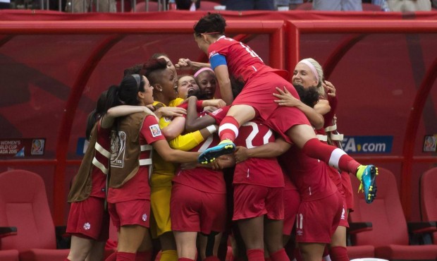 Team Canada celebrates Josee Belanger’s goal against Switzerland during the second half of th...
