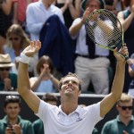 
              Richard Gasquet of France celebrates winning the singles match against Nick Kyrgios of Australia, at the All England Lawn Tennis Championships in Wimbledon, London, Monday July 6, 2015. Gasquet won 7-5, 6-1, 6-7, 7-6. (AP Photo/Kirsty Wigglesworth)
            