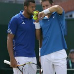 
              France's Jo-Wilfried Tsonga, left, and Nicolas Mahut speak during their doubles match against Britain's Andy Murray and Jamie Murray during the quarterfinal match of the Davis Cup at the Queen's Club in London, Saturday July 18, 2015. (AP Photo/Tim Ireland)
            