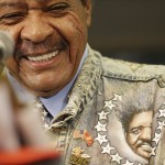 
              Don King, boxing promoter for Eric Molina, laughs and then stands up to speak during a WBC heavyweight boxing news conference, Thursday, June 11, 2015, in Birmingham, Ala. Heavyweight champion Deontay Wilder is to take on Molina on Saturday, June 13, in Birmingham. (AP Photo/Brynn Anderson)
            