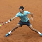 
              Roger Federer, of Switzerland, returns the ball to Tomas Berdych, of Czech Republic, during a quarter final match at the Italian Open tennis tournament, in Rome, Friday, May 15, 2015. Roger Federer kept alive his pursuit of an elusive clay-court title with a routine 6-3, 6-3 win over sixth-seeded Tomas Berdych on Friday to reach the Italian Open semifinals. (AP Photo/Alessandra Tarantino)
            