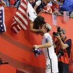 
              United States' Abby Wambach (20) gets a kiss from her wife, Sarah Huffman, after the U.S. beat Japan 5-2 in the FIFA Women's World Cup soccer championship in Vancouver, British Columbia, Canada, Sunday, July 5, 2015. (AP Photo/Elaine Thompson)
            