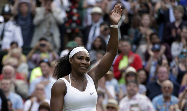 Serena Williams of the United States celebrates winning the singles match against Victoria Azarenka...