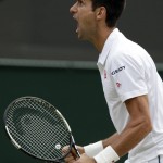 
              Novak Djokovic of Serbia celebrates winning a point against Kevin Anderson of South Africa during their singles match against at the All England Lawn Tennis Championships in Wimbledon, London, Tuesday July 7, 2015. (AP Photo/Alastair Grant)
            