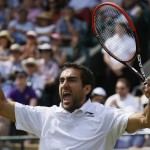 
              Marin Cilic of Croatia celebrates defeating John Isner of the United States in their singles match at the All England Lawn Tennis Championships in Wimbledon, London, Saturday July 4, 2015. Cilic won the match 7-6, 6-7, 6-4, 6-7, 12-10. (AP Photo/Kirsty Wigglesworth)
            