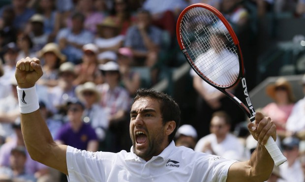 Marin Cilic of Croatia celebrates defeating John Isner of the United States in their singles match ...