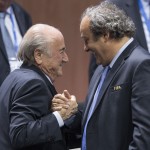 
              FIFA president Sepp Blatter after his election as President greeted by UEFA President Michel Platini, right, at the Hallenstadion in Zurich, Switzerland, Friday, May 29, 2015. Blatter has been re-elected as FIFA president for a fifth term, chosen to lead world soccer despite separate U.S. and Swiss criminal investigations into corruption. The 209 FIFA member federations gave the 79-year-old Blatter another four-year term on Friday after Prince Ali bin al-Hussein of Jordan conceded defeat after losing 133-73 in the first round.  (Patrick B. Kraemer/Keystone via AP)
            
