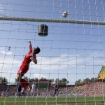 
              Japan goalkeeper Ayumi Kaihori (18) makes a save against England during the second half of a semifinal in the FIFA Women's World Cup soccer tournament, Wednesday, July 1, 2015, in Edmonton, Alberta, Canada. Japan won 2-1. (Jason Franson/The Canadian Press via AP)
            