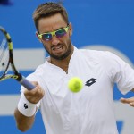 
              Viktor Troicki of Serbia plays a return to Andy Murray of Britain during their semifinal tennis match at the Aegon Championships in London, Sunday, June 21, 2015. (AP Photo/Kirsty Wigglesworth)
            