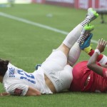 
              Canada's Ashley Lawrence, right, and England's Lucy Bronze fall onto the turf during the first half of a quarterfinal of the Women's World Cup soccer tournament, Saturday, June 27, 2015, in Vancouver, British Columbia, Canada. (Jonathan Hayward/The Canadian Press via AP
            