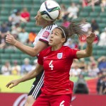 
              England's Fara Williams (4) and Germany's Melanie Behringer (7) vie for the ball during first-half action of a FIFA Women's World Cup soccer game in Edmonton, Alberta, Canada, on Saturday, July 4, 2015. (Jason Franson/The Canadian Press via AP) MANDATORY CREDIT
            