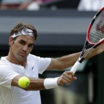 
              Roger Federer of Switzerland returns a ball to  Roberto Bautista Agut of Spain, during their singles match against at the All England Lawn Tennis Championships in Wimbledon, London, Monday July 6, 2015. (AP Photo/Alastair Grant)
            