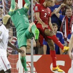 
              USA goal keeper Brad Guzan (1) grabs a corner kick as Panama midfielder Valentin Pimentel (2) pressures during the first half of a CONCACAF Gold Cup soccer match, Monday, July. 13, 2015, in Kansas City, Kan. (AP Photo/Colin E. Braley)
            
