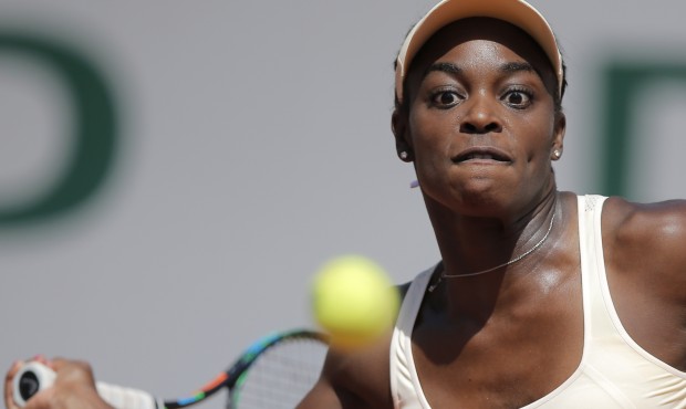 Sloane Stephens of the U.S. returns the ball to compatriot Serena Williams during their fourth roun...