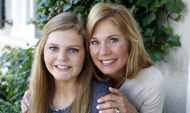 In this May 22, 2015 photo, Gracie Hussey, left, poses with her mother, Beth Hussey, at their home ...