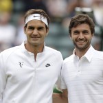 
              Roger Federer of Switzerland, left, and Gilles Simon of France pose for a photograph ahead of the men's quarterfinal singles match at the All England Lawn Tennis Championships in Wimbledon, London, Wednesday July 8, 2015. (AP Photo/Pavel Golovkin)
            
