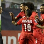 
              Panama's Valentin Pimentel, center right, points at referee Mark Geiger, who had given a red card to Panama's Luis Tejada, not seen, during the first half of Panama's CONCACAF Gold Cup soccer semifinal against Mexico on Wednesday, July 22, 2015, in Atlanta. (AP Photo/David Goldman)
            