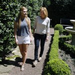 
              In this May 22, 2015 photo, Gracie Hussey, 15, left, and her mother, Beth Hussey, walk through their yard in Memphis, Tenn. After suffering multiple concussions playing soccer, Hussey has headaches, suffers from inexplicable nausea and several times a day she feels like she’s about to pass out. While her athletic career may be over, Gracie and her mother have embarked on a new endeavor -- advocating that youth soccer coaches keep headers out of the game until kids are 14. (AP Photo/Karen Pulfer Focht)
            