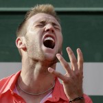 
              Jack Sock of the U.S. screams after missing a shot in the fourth round match of the French Open tennis tournament against Spain's Rafael Nadal at the Roland Garros stadium, in Paris, France, Monday, June 1, 2015. (AP Photo/Thibault Camus)
            