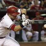 
              Arizona Diamondbacks' Chris Owings bunts the ball to reach first base for a single during the sixth inning of a baseball game against the Miami Marlins, Monday, July 20, 2015, in Phoenix. (AP Photo/Ross D. Franklin)
            