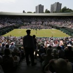 
              Spectators on No. 1 Court watch the match between Milos Raonic of Canada and Tommy Haas of Germany at the All England Lawn Tennis Championships in Wimbledon, London, Wednesday July 1, 2015. (AP Photo/Tim Ireland)
            