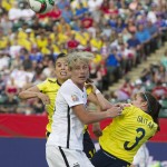
              United States' Abby Wambach, front, goes for the ball with Colombia's Nataly Arias  and Natalia Gaitan (3) during first half FIFA Women's World Cup round of 16 action in Edmonton, Alberta, Canada, Monday, June 22, 2015.  (Jason Franson/The Canadian Press via AP) MANDATORY CREDIT
            