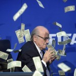 
              FIFA president Sepp  Blatter is photographed  while banknotes thrown by British comedian Simon Brodkin hurtle through the air during a press conference following the extraordinary FIFA Executive Committee at the  headquarters in Zurich, Switzerland, Monday, July 20, 2015. During the extraordinary FIFA Executive Committee meeting the agenda for the elective Congress for the FIFA presidency was finalized and approved: The congress will take place on Feb. 26.  2016.  (Ennio Leanza/Keystone via AP)
            
