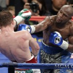 
              ADVANCE FOR WEEKEND EDITIONS, APRIL 25-26 - FILE - In this Sept. 14, 2013, file photo, Floyd Mayweather Jr., right, throws a punch against Canelo Alvarez during a 152-pound title fight in Las Vegas. This is not Hagler-Hearns or Tyson vs. Anyone. Floyd Mayweather Jr. is the greatest defensive boxer in history, and Manny Pacquiao hasn't shown knockout power in a while. Expect this fight to go to the scorecards. (AP Photo/Isaac Brekken, File)
            