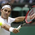 
              Roger Federer of Switzerland returns to Novak Djokovic of Serbia during the men's singles final at the All England Lawn Tennis Championships in Wimbledon, London, Sunday July 12, 2015. (AP Photo/Alastair Grant)
            